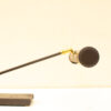 Sleek adjustable microphone on a stylish base, perfect for studio or performance use.
