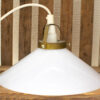 Elegant vintage pendant lamp with glossy white glass shade and aged brass fixture. Perfect for any decor.