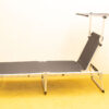 Modern lounge chair with adjustable canopy, perfect for outdoor relaxation and style.