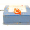 Worn blue Mazeklin transformer with orange knob and red light, perfect for vintage enthusiasts.