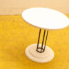 Sleek white and black minimalist table with geometric design, perfect for stylish modern spaces.