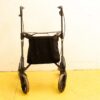 Lightweight compact walker with storage bag, ergonomic grips, and smooth wheels for mobility support.