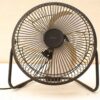 Retro black table fan for vintage charm and effective cooling in any space.