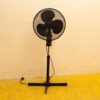 Classic standing electric fan for effective cooling and timeless style in any space.