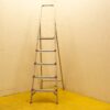 Durable aluminum step ladder with red grips, ideal for home projects and workspace tasks.