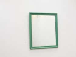 Vibrant green mirror adds fresh style and elegance to any living space.