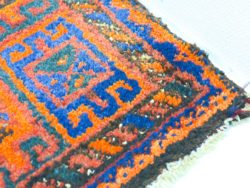 Handwoven vintage rug with vibrant geometric patterns, enhancing any stylish interior space.