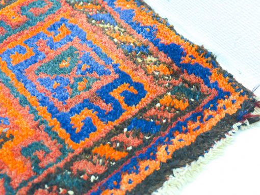 Handwoven vintage rug with vibrant geometric patterns, enhancing any stylish interior space.