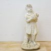 Joyful vintage girl statue with flowers, ideal for charming home and garden decor.