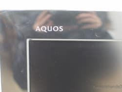 Sleek Sharp AQUOS TV with glossy finish, ideal for enhancing modern entertainment spaces.