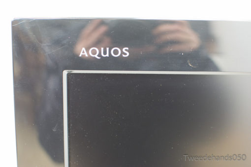 Sleek Sharp AQUOS TV with glossy finish, ideal for enhancing modern entertainment spaces.