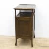 Charming vintage wooden nightstand with storage, warm tones, and elegant curved design for any room.