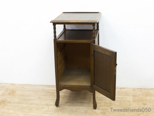 Charming vintage wooden nightstand with storage, perfect for any rooms decor style.