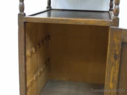 Rustic vintage wooden cabinet with warm tones and adjustable shelves for stylish storage solutions.