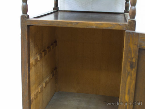 Rustic vintage wooden cabinet with warm tones and adjustable shelves for stylish storage solutions.