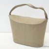 Chic beige handbag with minimalist design, perfect for everyday wear and versatile styling.