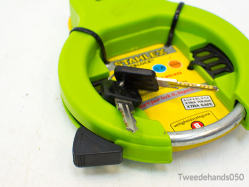 Vibrant green multifunctional tape measure with keys for efficient DIY and home improvement tasks.