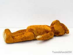 Nostalgic golden teddy bear, a timeless childhood companion radiating warmth and affection.