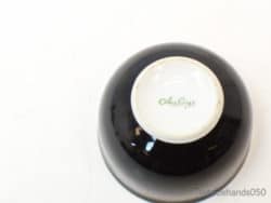 Black Arzberg bowl with glossy finish and elegant white interior, perfect for modern decor.