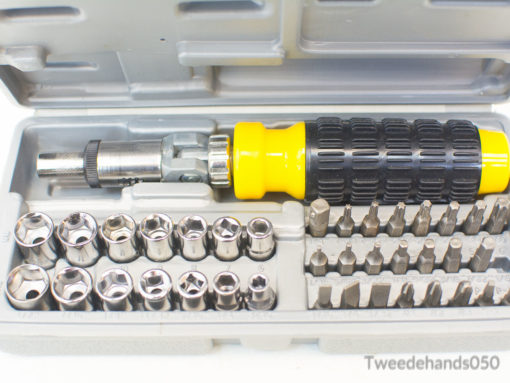 Ergonomic ratcheting screwdriver set with organized bits and sockets in a durable gray case.