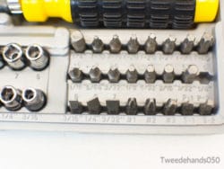 Ergonomic yellow screwdriver toolkit with organized bits and sockets for efficient mechanical tasks.