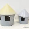 Charming gray toy houses with cheerful yellow roofs, perfect for inspiring childrens creativity.