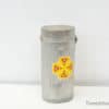 Vintage metal canister with vibrant floral design, perfect for decor and storage options.