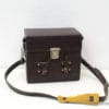 Classic dark brown leather bag with vibrant yellow strap for stylish everyday use.