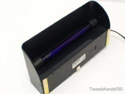 Modern Sigma MD 2306 UV lamp for verifying antiques and detecting counterfeit items.