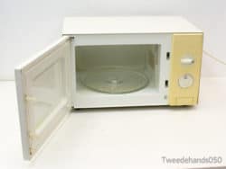 Vintage white microwave with rotary knobs, perfect for adding retro style to your kitchen.