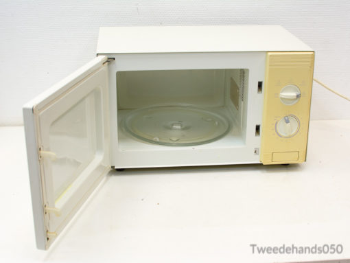 Vintage white microwave with rotary knobs, perfect for adding retro style to your kitchen.