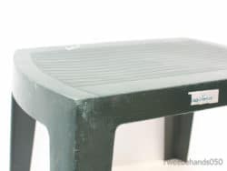 Durable dark green plastic stool with slip-resistant surface, ideal for versatile indoor and outdoor use.