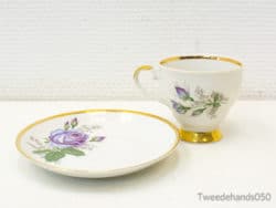 Elegant porcelain tea set with lavender roses and gold trim for refined gatherings.