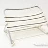 Sleek black-and-white folding chair for modern, versatile seating indoors and outdoors.