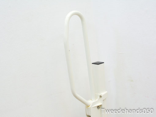 Ergonomic white handrail designed for safety and comfort in public spaces and bathrooms.