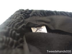 Cozy black ruffle beanie by JMM, perfect blend of style and comfort for all occasions.