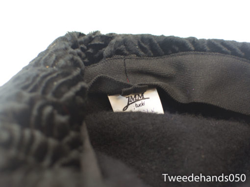 Cozy black ruffle beanie by JMM, perfect blend of style and comfort for all occasions.