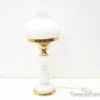 Elegant white vintage lamp with gold accents and swirling texture for stylish home decor.