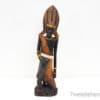 Elegant wooden sculpture celebrating African cultural heritage and craftsmanship with intricate details.