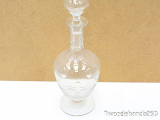 Timeless glass decanter with elegant design, perfect for serving wine and enhancing decor.