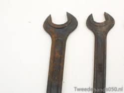 Vintage open-end wrenches showcasing wear, perfect for collectors and mechanics who value history.
