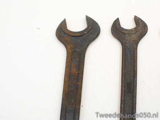 Vintage open-end wrenches showcasing wear, perfect for collectors and mechanics who value history.
