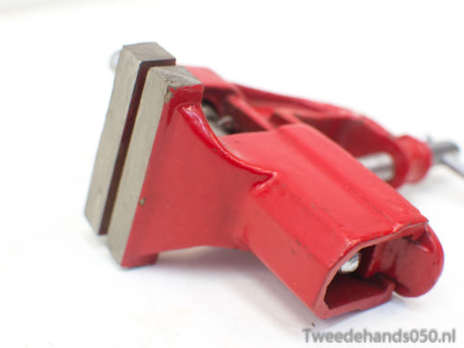 Durable red clamp for woodworking and crafts, ensuring a secure grip in DIY projects.