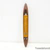 Vintage thermometer with yellow scale and elegant wooden frame for stylish retro decor.