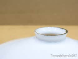 Elegant porcelain dish with gold trim, perfect for upscale dining and stylish home decor.