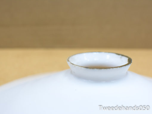 Elegant porcelain dish with gold trim, perfect for upscale dining and stylish home decor.