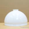 Elegant white cloche for stylish food presentation and warmth at any dining occasion.