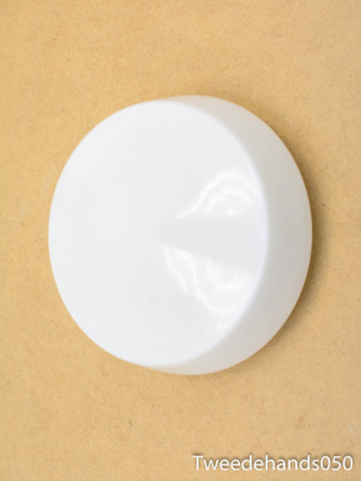 Sleek white circular decor piece, ideal for minimalist spaces and versatile design uses.