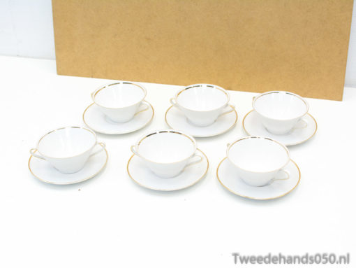 Elegant porcelain teacups with gold trim, perfect for sophisticated tea gatherings.