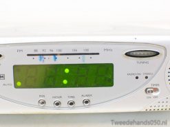Modern TCM 86835 clock radio with green display, FM tuning, and user-friendly alarm features.